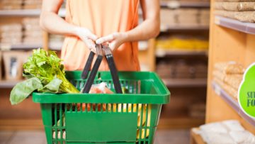 Woman with some groceries in a basket