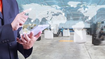 hand presses on world map with digital tablet,warehouse worker loading goods by forklift for Logistic Import Export background (Elements of this image furnished by NASA)