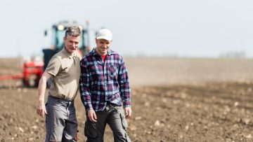 father and son working in agriculture