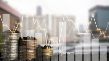 Double exposure of graph and rows of coins for finance and busin