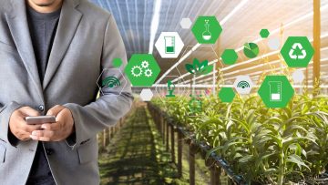 agriculture technology concept man Agronomist Using a Tablet Int