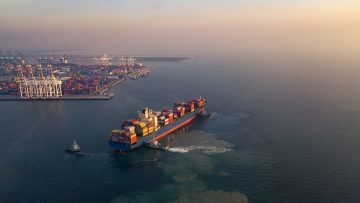 Aerial view from drone, Cargo vessel in beautiful scenic sky. Pr