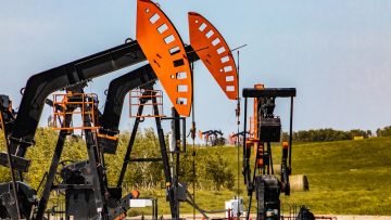 Oil well pumpjack in rural landscape