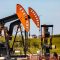 Oil well pumpjack in rural landscape