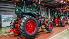 Tractor industry manufacture. New tractors on factory line. Production of agricultural machinery