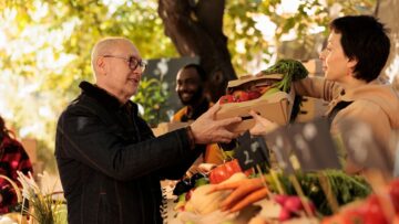 Senior man buying various natural farm products