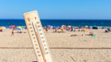 Thermometer for the temperature on the beach, in the summer in the heat. Global warming.